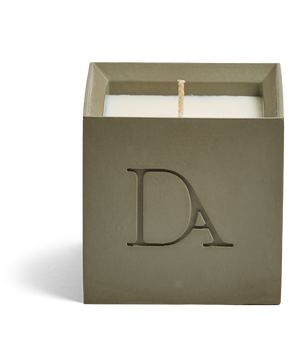 9oz Devetu artisanal concrete square candle named Wild Nomad, uncovered, showcasing the richly textured wax surface, in a deep olive green with ‘DA’ Devetu Aroma logo embossed on the front